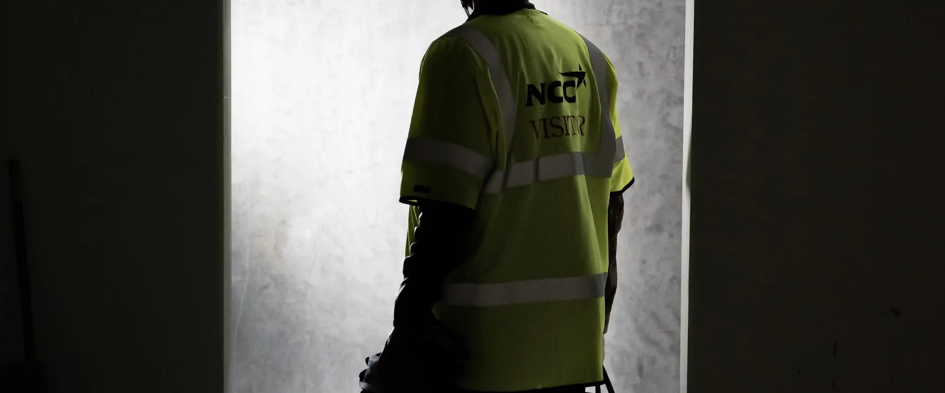 Worker in personal protective equipment performing cleanup